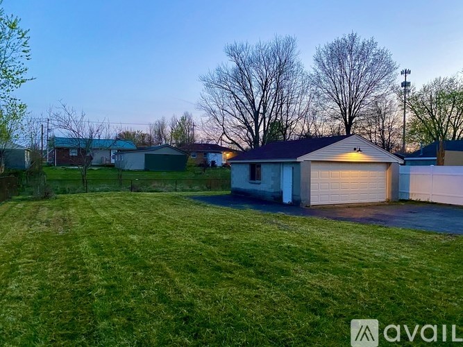 A house with a garage is available for sale.