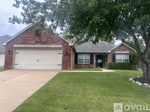 A house with a brick exterior and a white garage door.