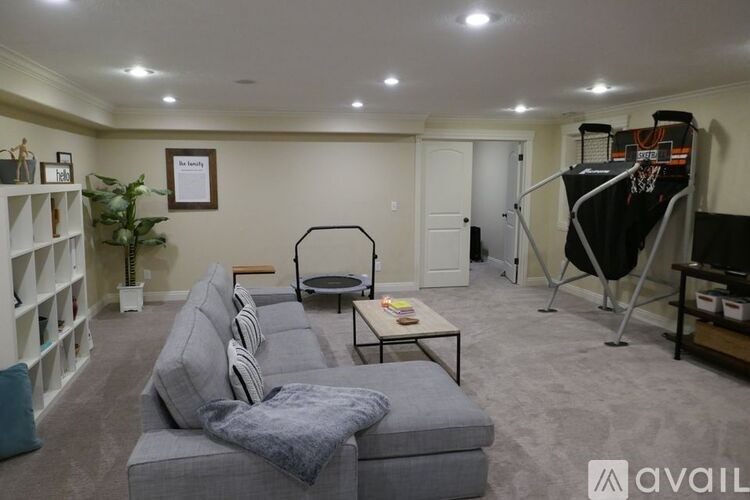 A living room with a grey sofa and a coffee table.