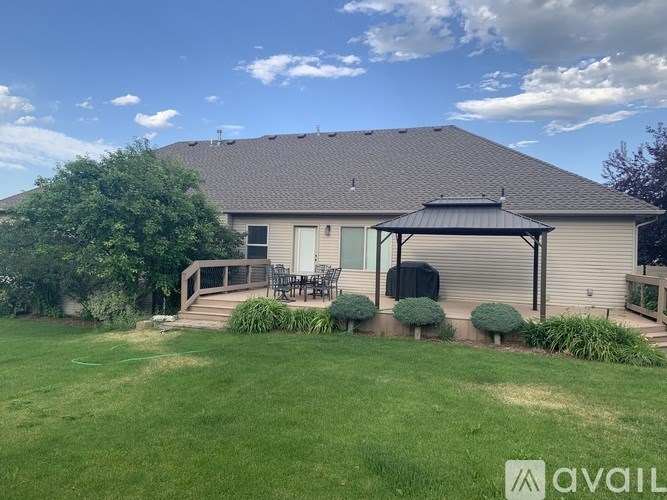 A house with a patio and a lawn.