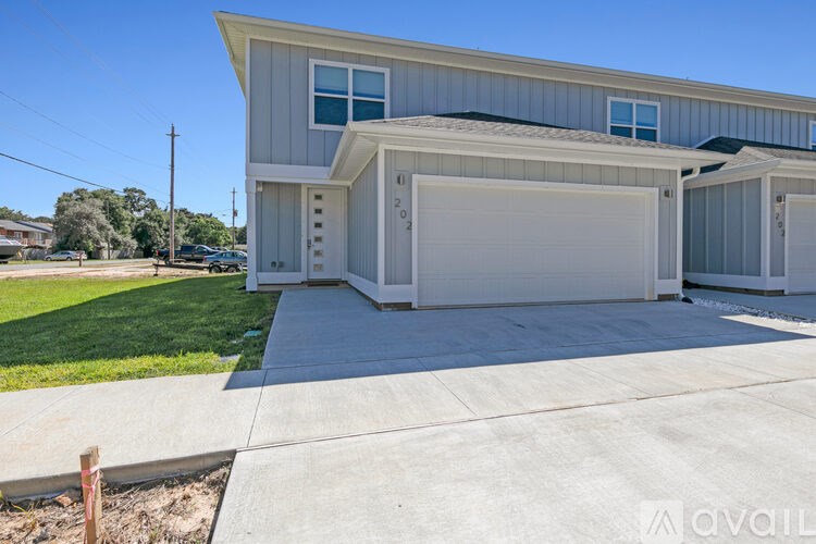 A two-car garage is attached to a house.