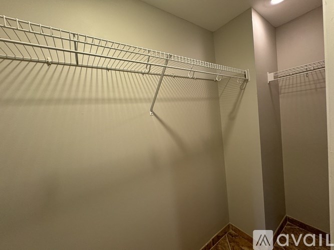 A long hallway with a light on the ceiling.