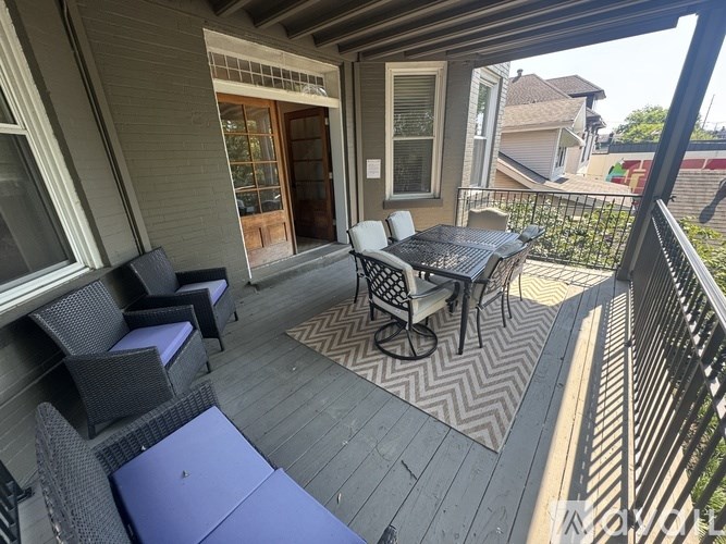 A patio with a table and chairs.