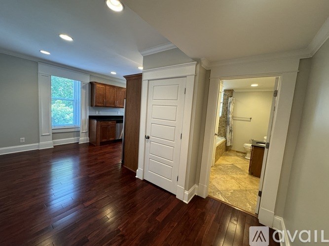 A room with wooden floors and white walls.