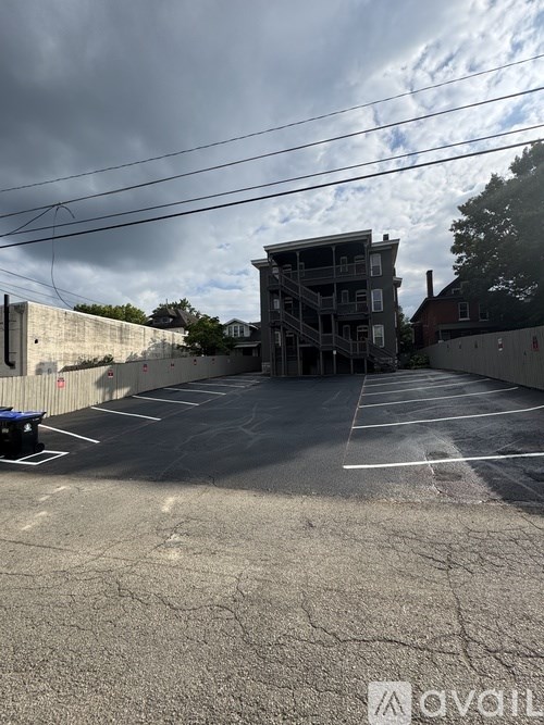 A bathroom with a walk-in shower and a white door leading to a pantry.