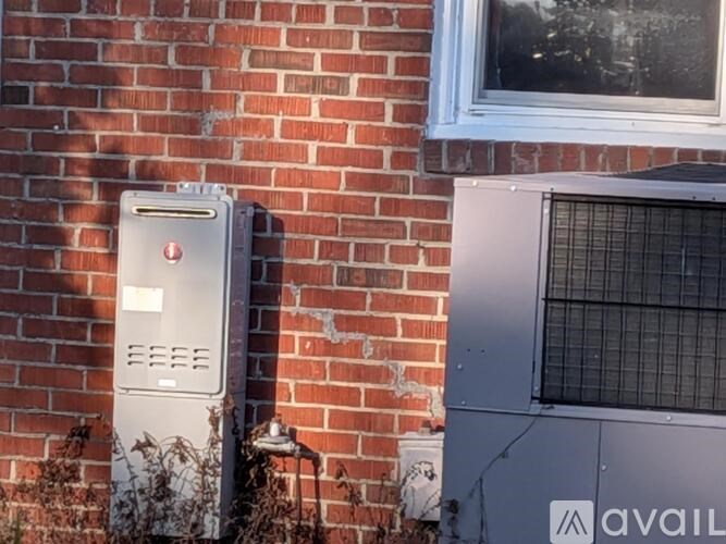A room with wooden floors and a ceiling fan.