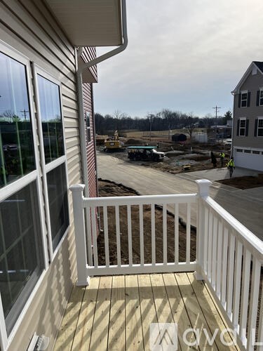 A view from a porch looking out at a construction site.