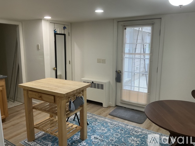 A kitchen with wooden cabinets and a white refrigerator.