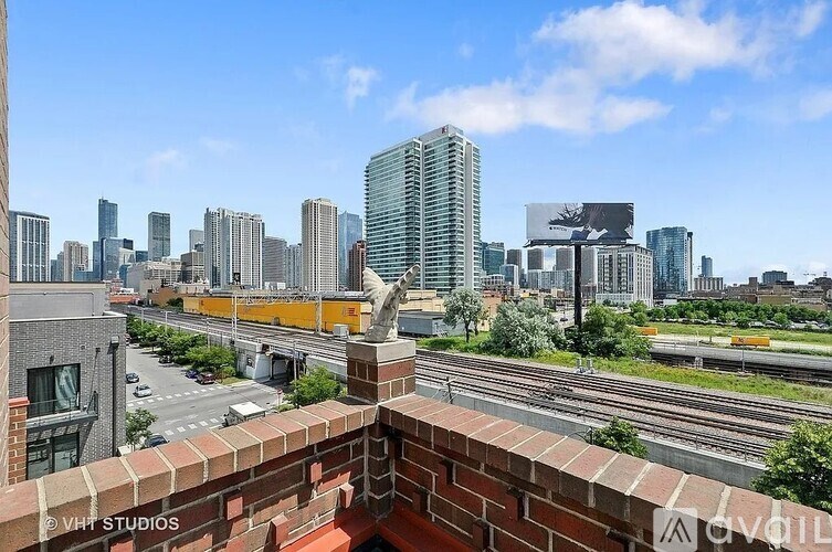 A cityscape with a train track running through the middle.