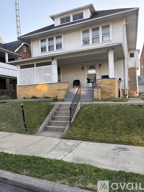 A house with a white exterior and a black roof.