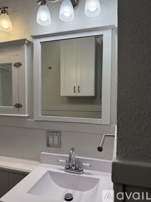 A bathroom sink with a mirror above it.