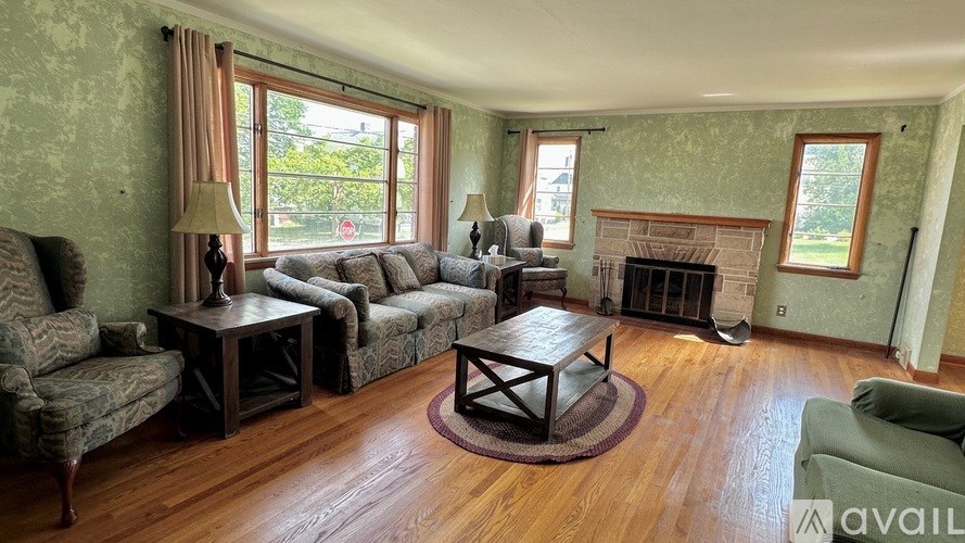 A living room with a fireplace and a couch.