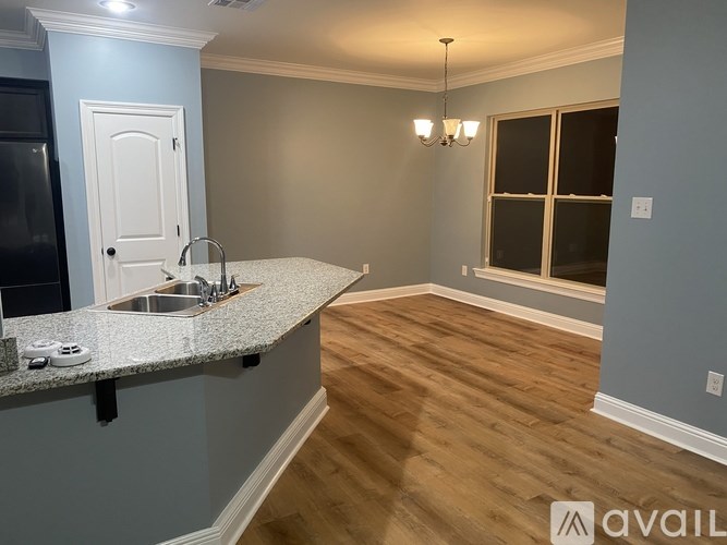 A kitchen with a sink and a window.