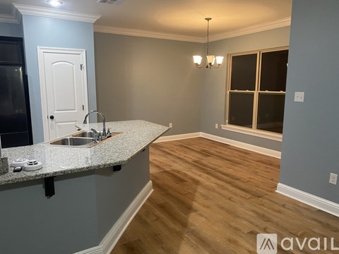 A kitchen with a sink and a window.