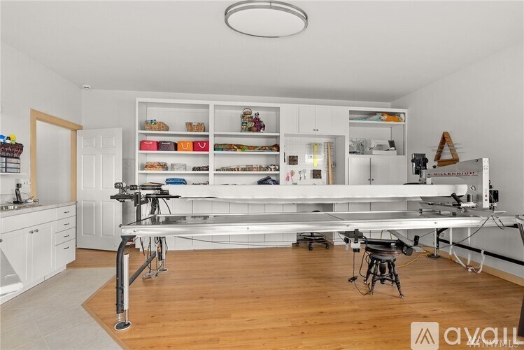 A kitchen with a large island and a lot of counter space.