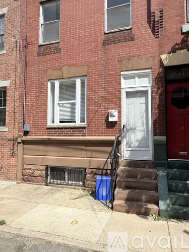 A red door is on the right side of a white door.