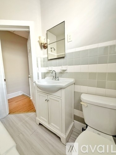 A laundry room with washers and dryers.