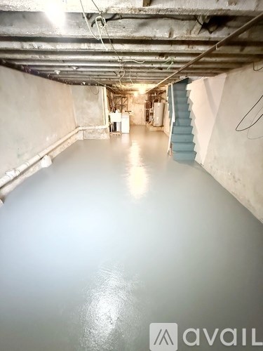 A laundry room with washers and dryers.