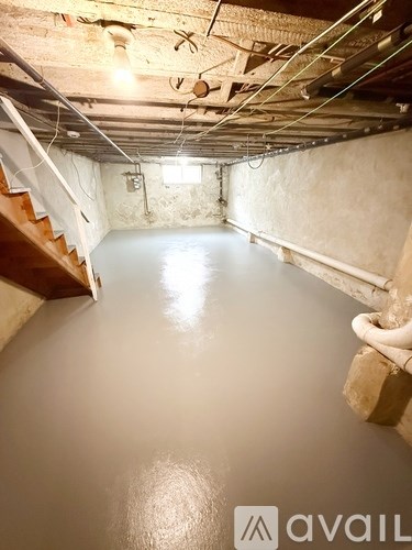 A kitchen with white cabinets and a granite countertop.