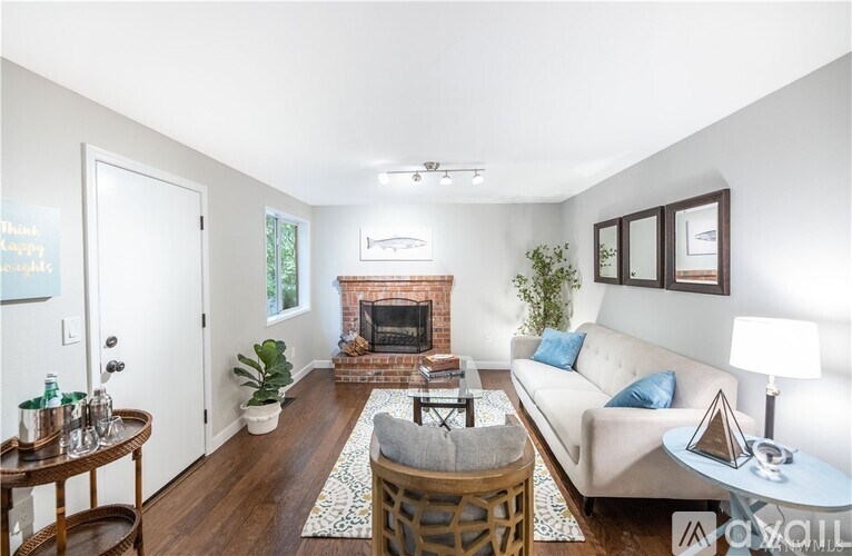 A living room with a fireplace and a couch.