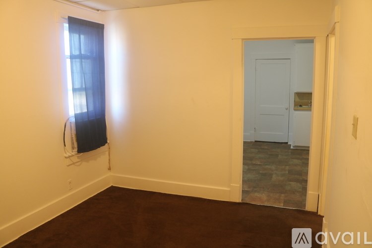 A room with a door and a window.