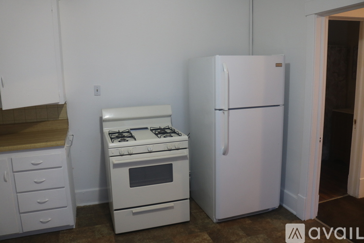 A white fridge and stove in a kitchen.