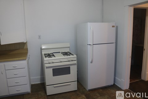 A white fridge and stove in a kitchen.