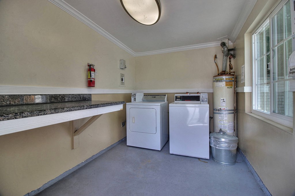 A laundry room with a washer and dryer.