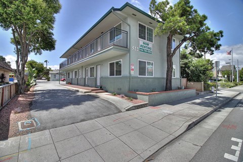A street view of a building with the sign