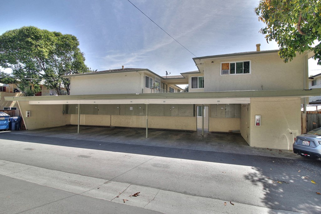 an empty building with a street in front of it