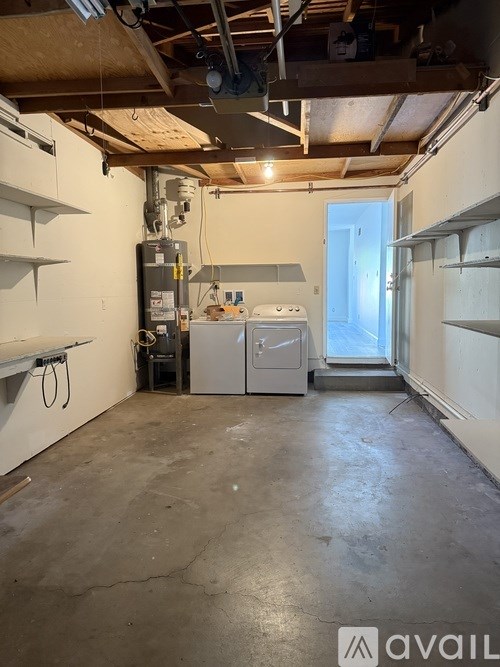 A room with a washer and dryer in it.