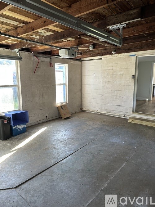 A room with a concrete floor and a window.