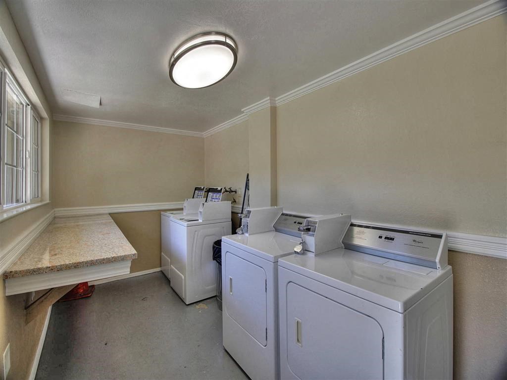 A laundry room with a washer and dryer.