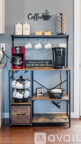 A coffee bar with a sign that says "Coffee and No One Gives a Hoot".