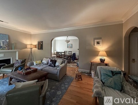 A living room with a grey couch and a coffee table.