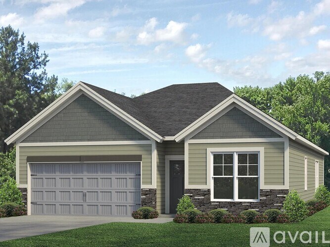 A two-car garage is attached to a house.