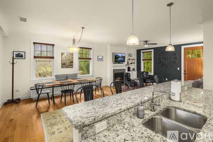 A kitchen with granite countertops and a sink.