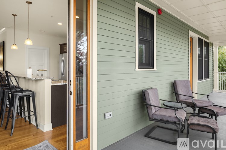 A patio with a table and chairs is available.