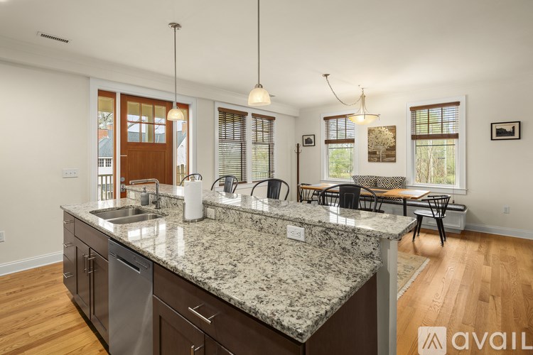 A kitchen with granite countertops and stainless steel appliances.