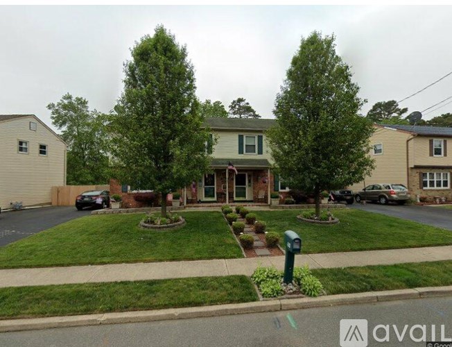 A residential area with houses and greenery.