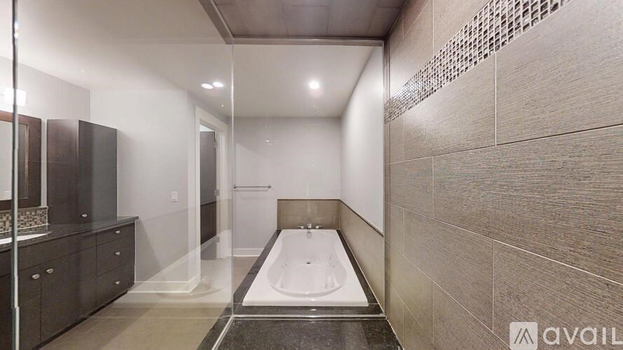 A bathroom with a tub and a walk-in shower.