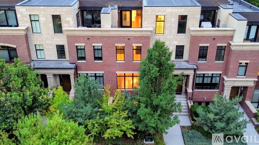 A building with a sign that says "AVAIL" in front of it.