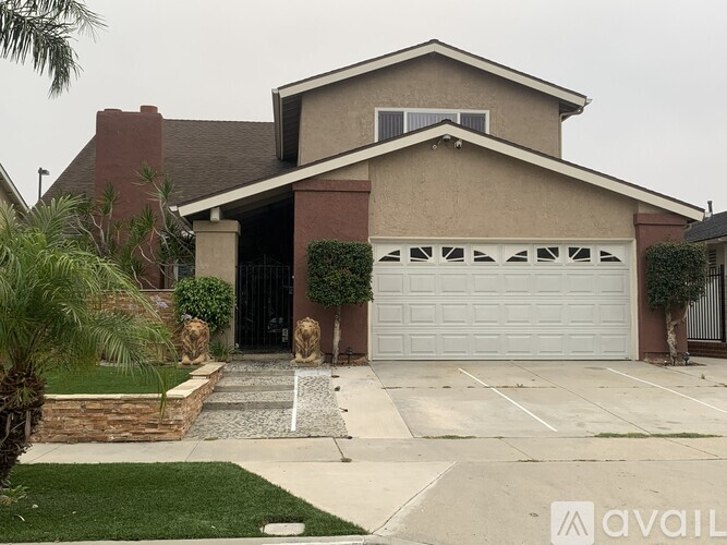 A house with a garage and a driveway.