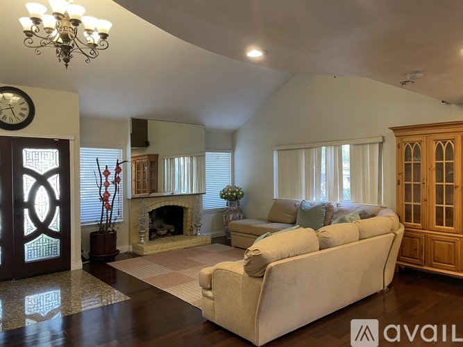 A living room with a fireplace and a couch.