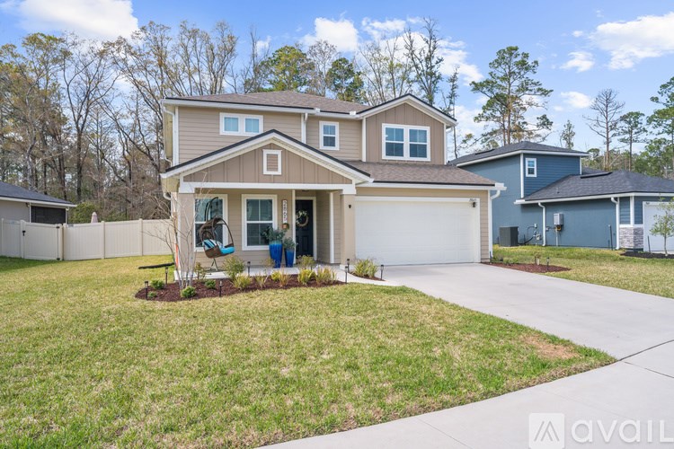 A house with a brown roof and a white garage door is available for sale.