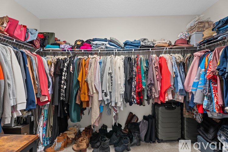 A room full of clothes and shoes.