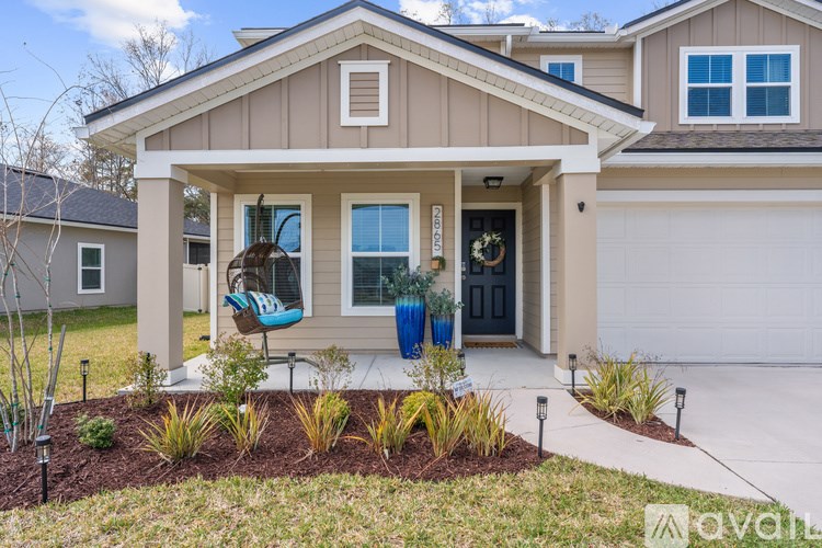 A house with a front yard and a garage.