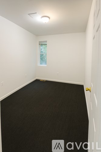 A room with a window and a door.