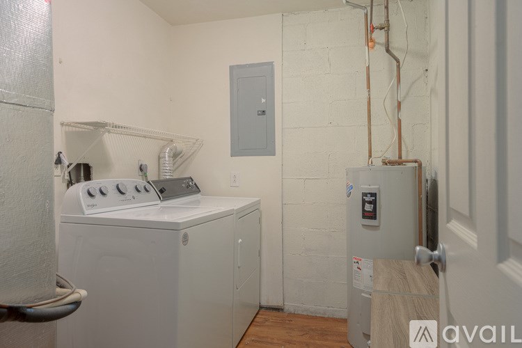 A laundry room with a washer and dryer.