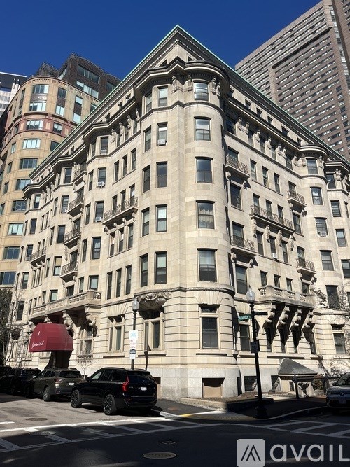 A large, ornate building with a car parked in front of it.